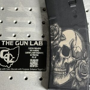 Halftone image of a human skull and roses on a pmag